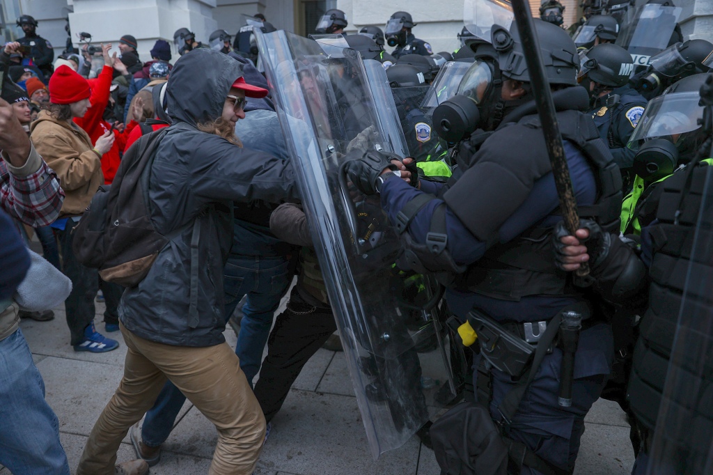  Security forces clash with US President Donald Trumps supporters after they breached the US Capitol.