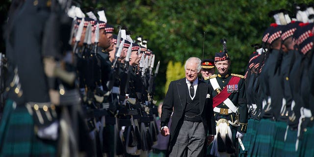 King Charles III inspects the Guard of Honour as he arrives to attend the Ceremony of the Keys, at the Palace of Holyroodhouse, Edinburgh, Monday, Sept. 12, 2022.