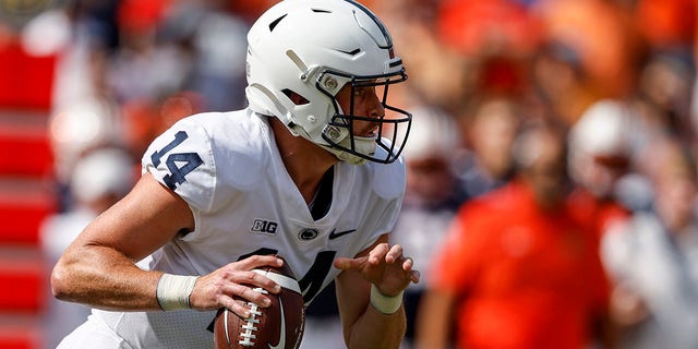 Penn State quarterback Sean Clifford scrambles for yardage during the first half of a game against Auburn, Saturday, Sept. 17, 2022, in Auburn, Ala.