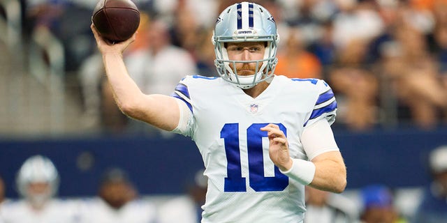 Cooper Rush of the Dallas Cowboys drops back to pass against the Cincinnati Bengals at AT and T Stadium Sept. 18, 2022, in Arlington, Texas.