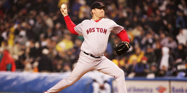 Pitcher Curt Schilling of the Boston Red Sox throws a pitch against the New York Yankees in the first inning of Game 6 of the American League Championship Series Oct. 19, 2004, at Yankee Stadium in the Bronx borough of New York City.