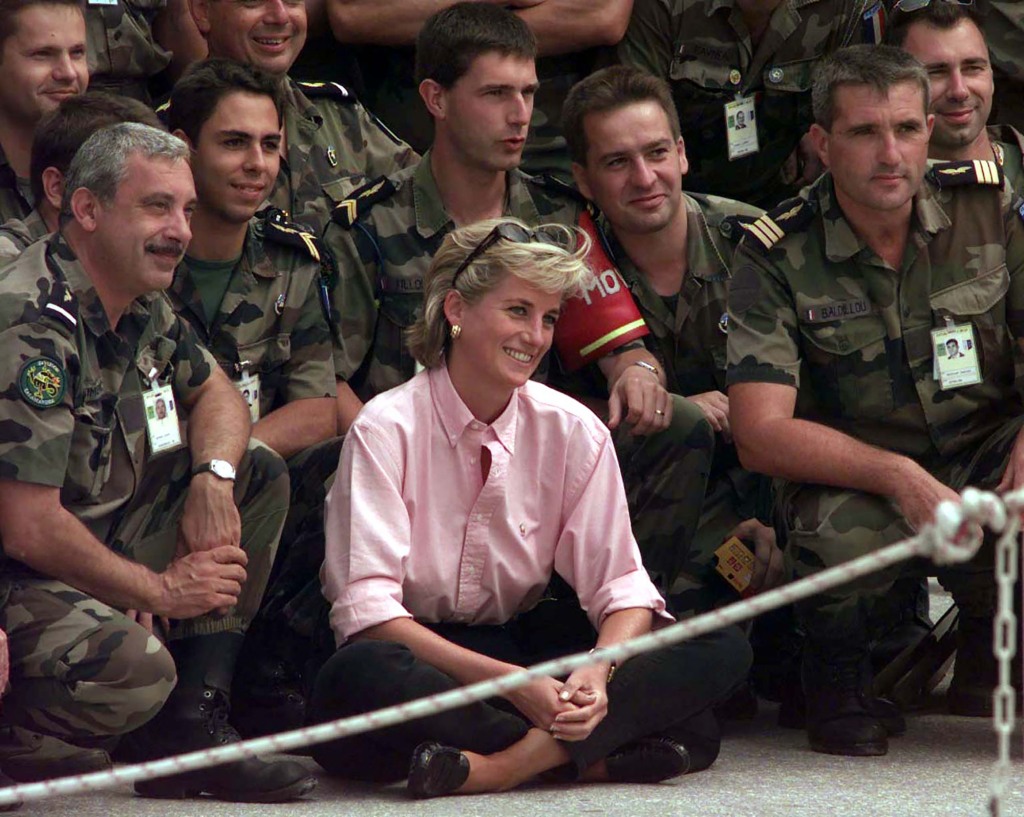 Diana, Princess of Wales poses for a photograph with some French SFOR soldiers at Sarajevo Airport