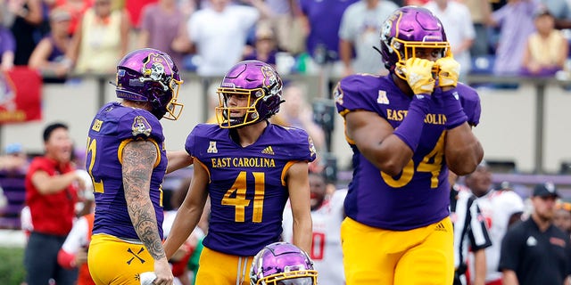 East Carolina's Luke Larsen (12) consoles kicker Owen Daffer (41) following a missed field goal attempt against North Carolina State during the second half of an NCAA college football game in Greenville, N.C., Saturday, Sept. 3, 2022.