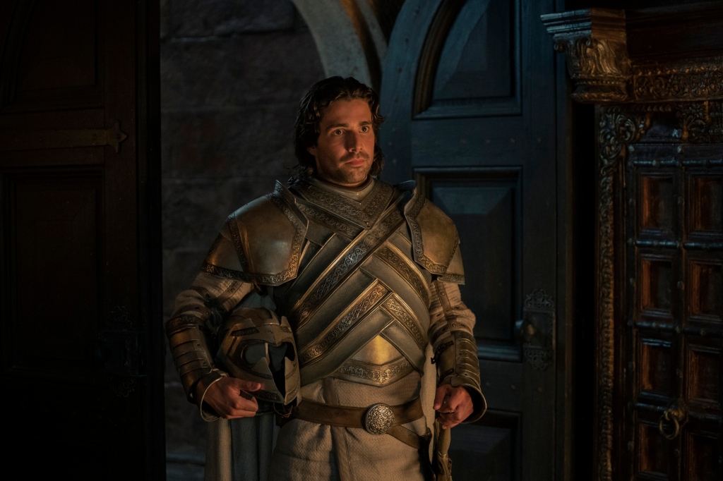 Criston Cole (Fabien Frankel) entering a room looking serious. 