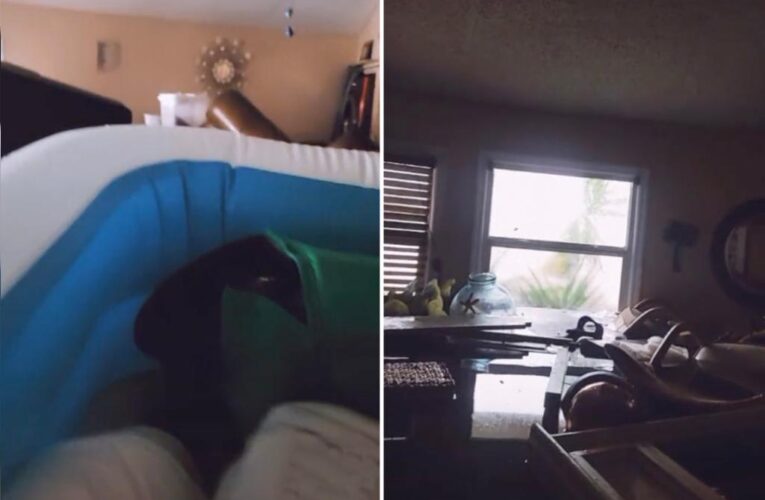 Hurricane victim floats in inflatable pool in Ian ravaged home