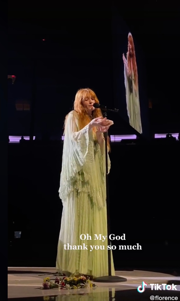 Florence was in the middle of chatting with the crowd when the hand was flung onstage by an unknown audience member. 