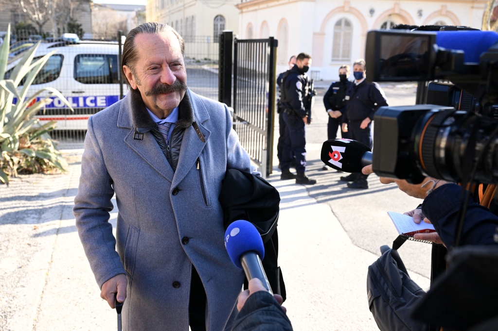 Frederic Monneret, lawyer of French dentist Lionel Guedj, accused of fraud and dental mutilation, addresses media as he arrives at the courthouse on the first day of the trial of his client in Marseille, Southern France, on February 28, 2022.