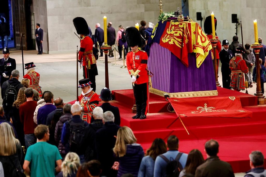 Royal guards stand by the coffin of Britain's Queen Elizabeth II