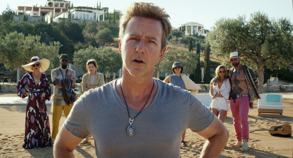 Miles Bron (Edward Norton) is a billionaire who summons his friends to a Greek Island for a murder mystery weekend. 