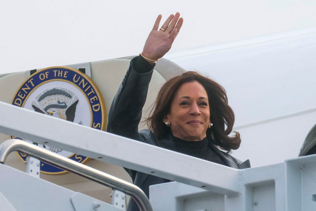 US Vice President Kamala Harris waves while boarding Air Force Two at Joint Base Andrews.