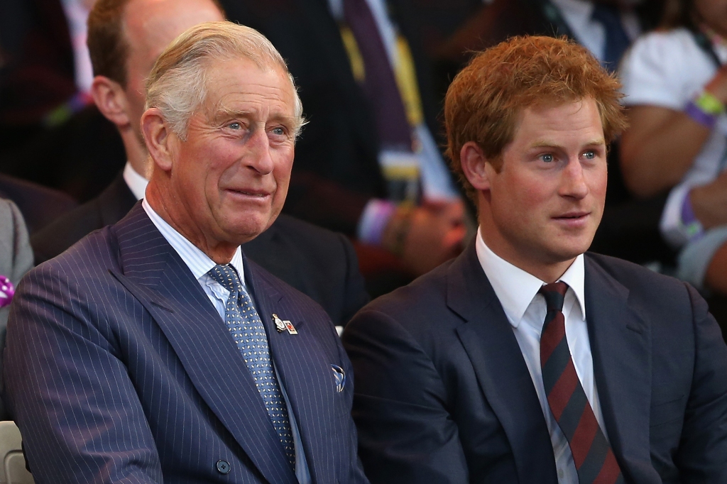 LONDON, ENGLAND - SEPTEMBER 10:  Prince Charles, Prince of Wales and Prince Harry laugh during the Invictus Games Opening Ceremony on September 10, 2014 in London, England. The International sports event for 'wounded warriors', presented by Jaguar Land Rover, is just days away with limited last-minute tickets available at www.invictusgames.org  (Photo by Chris Jackson/Getty Images)