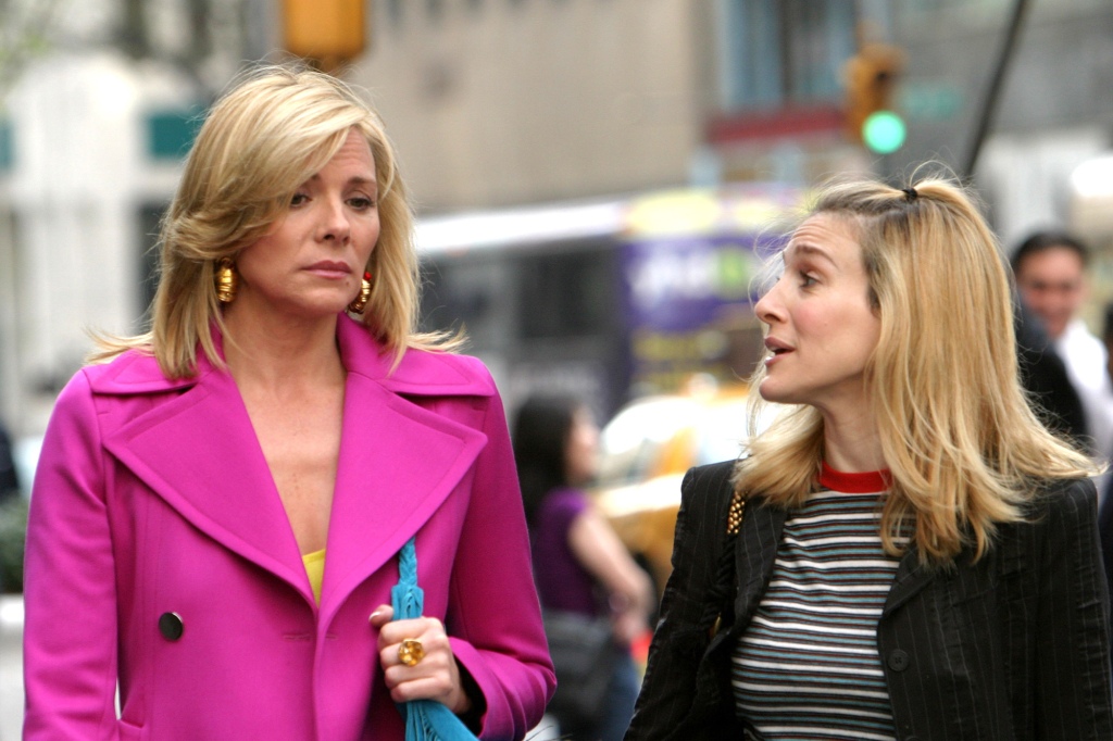 Kim Cattrall and Sarah Jessica Parker during Kim Cattrall and Sarah Jessica Parker On Location For Sex And The City at Saks Fifth Ave in New York, New York, United States. (Photo by James Devaney/WireImage)
