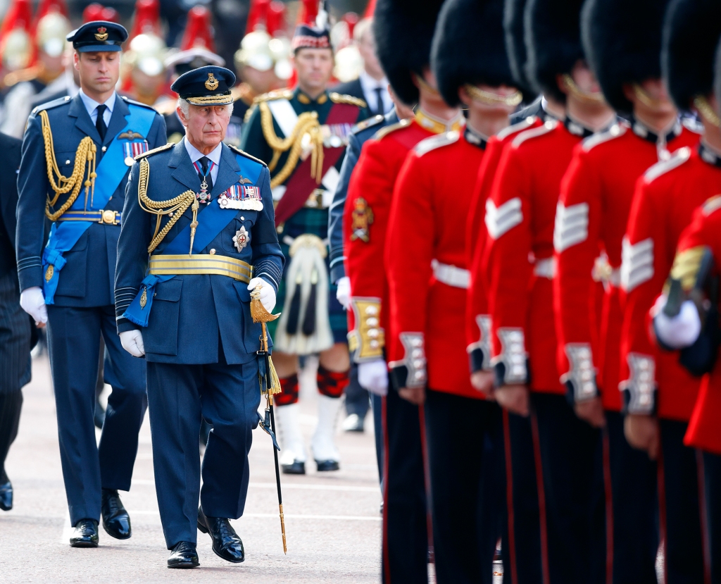 LONDON, UNITED KINGDOM - SEPTEMBER 14: (EMBARGOED FOR PUBLICATION IN UK NEWSPAPERS UNTIL 24 HOURS AFTER CREATE DATE AND TIME) Prince William, Prince of Wales and King Charles III walk behind Queen Elizabeth II's coffin as it is transported on a gun carriage from Buckingham Palace to The Palace of Westminster ahead of her Lying-in-State on September 14, 2022 in London, United Kingdom. Queen Elizabeth II's coffin is taken in procession on a Gun Carriage of The King's Troop Royal Horse Artillery from Buckingham Palace to Westminster Hall where she will lay in state until the early morning of her funeral. Queen Elizabeth II died at Balmoral Castle in Scotland on September 8, 2022, and is succeeded by her eldest son, King Charles III. (Photo by Max Mumby/Indigo/Getty Images)