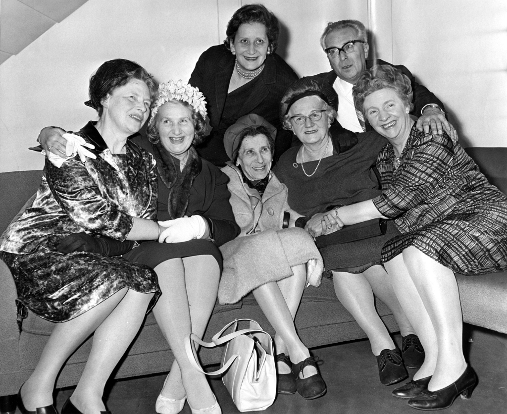 The sisters (posing here with some of the people they saved) were honored at the Israeli Embassy in London. 