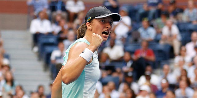 Iga Swiatek of Poland celebrates a point against Ons Jabeur of Tunisia during their Women’s Singles Final match on Day Thirteen of the 2022 US Open at USTA Billie Jean King National Tennis Center on September 10, 2022 in the Flushing neighborhood of the Queens borough of New York City.