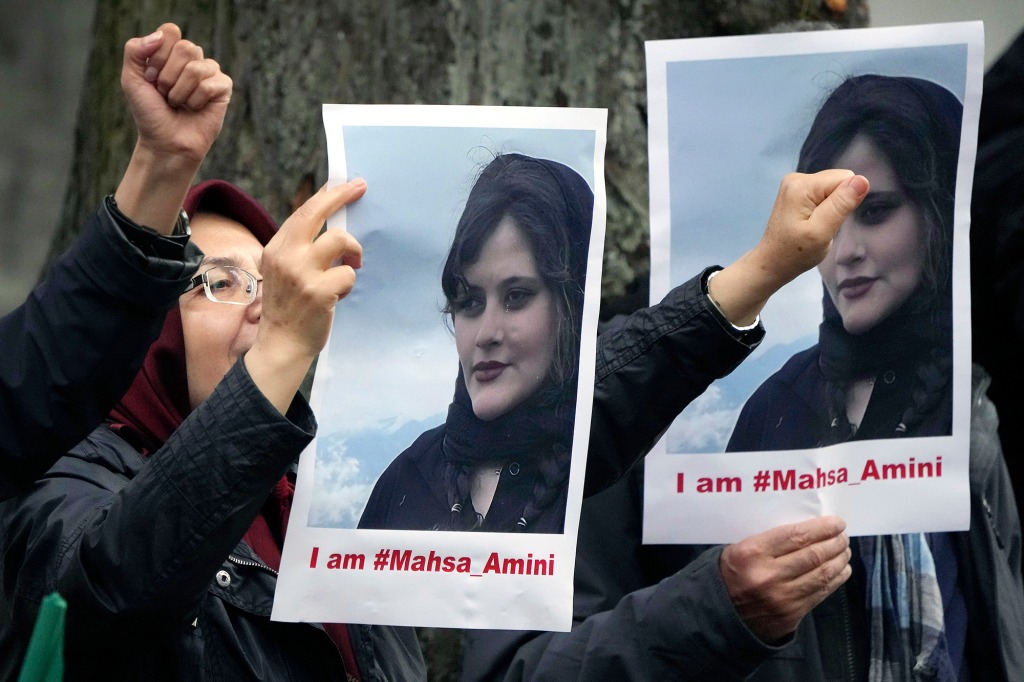 Exile Iranians of the National Council of Resistance of Iran gather in front of the embassy of Iran in Berlin