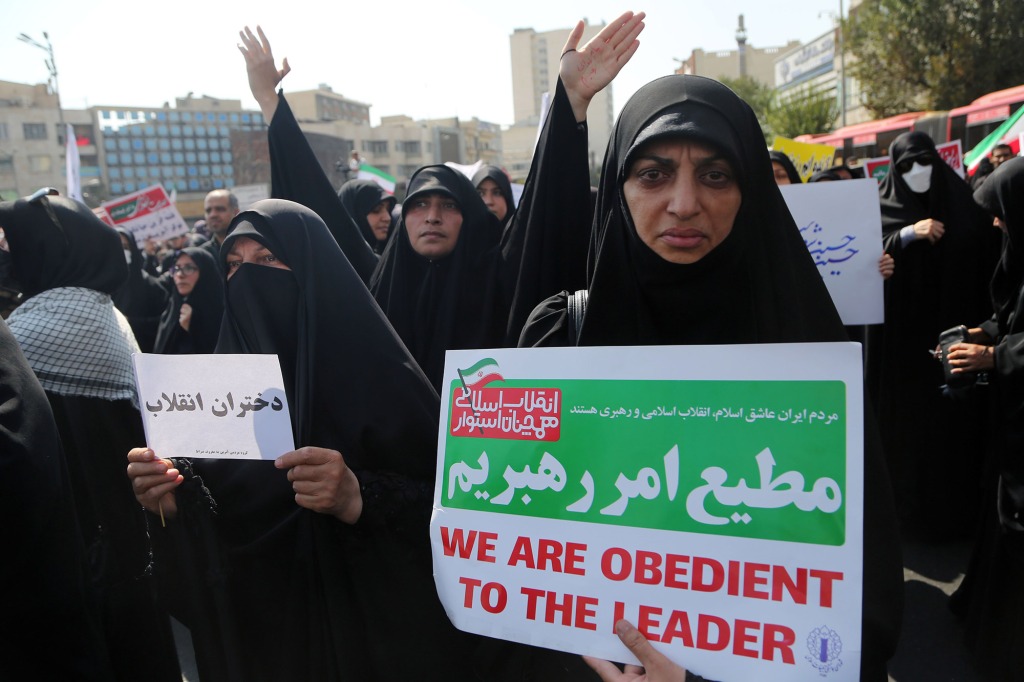 Iranians stage a demonstration in support of the Iranian government and security forces after protests broke out following the death of a 22-year-old woman under custody in Tehran, Iran on September 23, 2022.