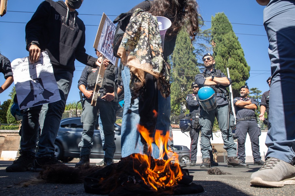 A group of students burned some veils as a form of protest. Protest in front of the embassy of Iran organized by Iranian students living in Rome to protest against violence of Iranian regime and against death of Mahsa Amini, girl who died in Iran on September 16 after being arrested by the Tehran police for not wearing the veil correctly.