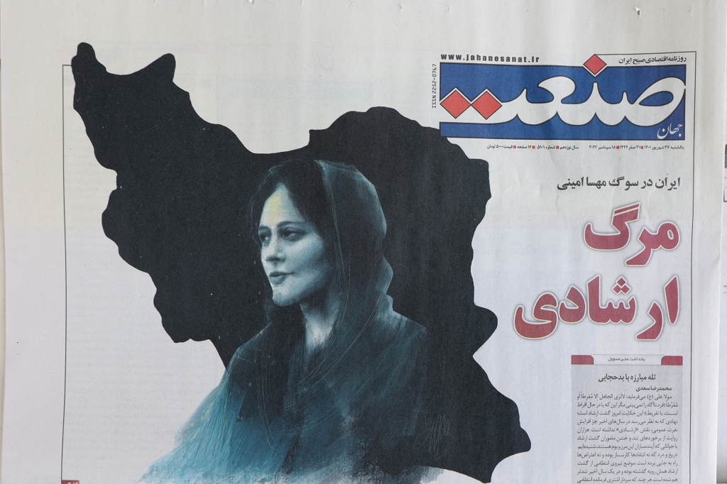 A newspaper with a cover picture of Mahsa Amini