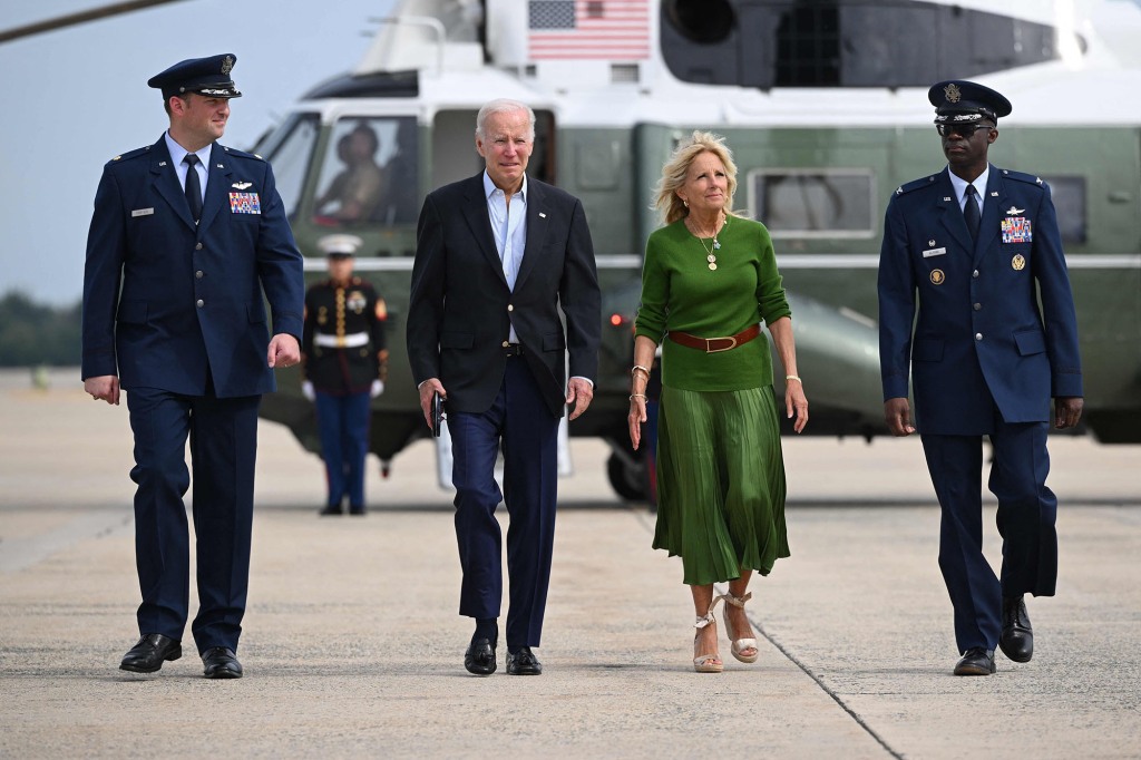 US First Lady Jill Biden walks with US President Joe Biden as he prepares to board Air Force One at Joint Base Andrews in Maryland.