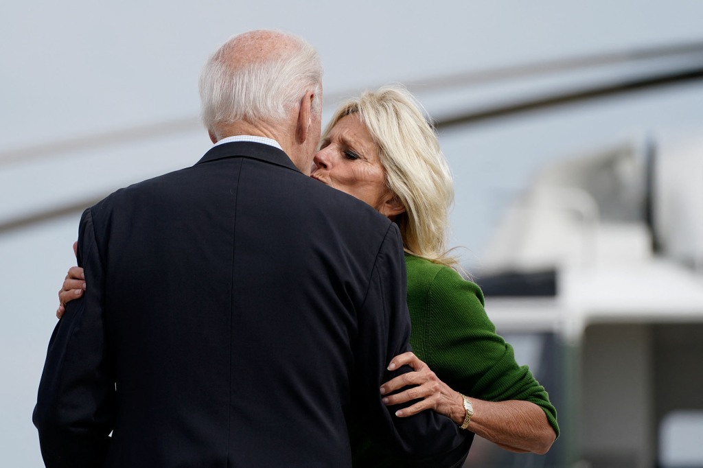 U.S. President Joe Biden and first lady Jill Biden embrace before U.S. President Joe Biden boards Air Force One en route to Milwaukee.