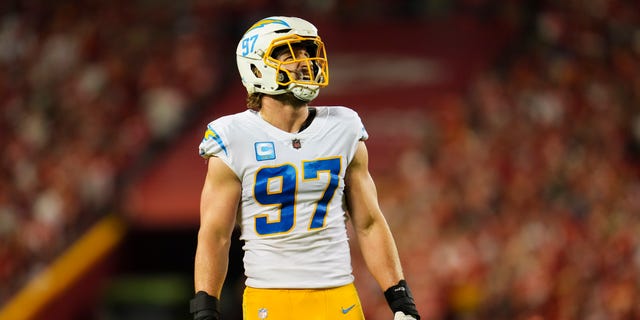 Joey Bosa of the Los Angeles Chargers looks up at the scoreboard against the Kansas City Chiefs at GEHA Field at Arrowhead Stadium Sept. 15, 2022, in Kansas City, Mo. 