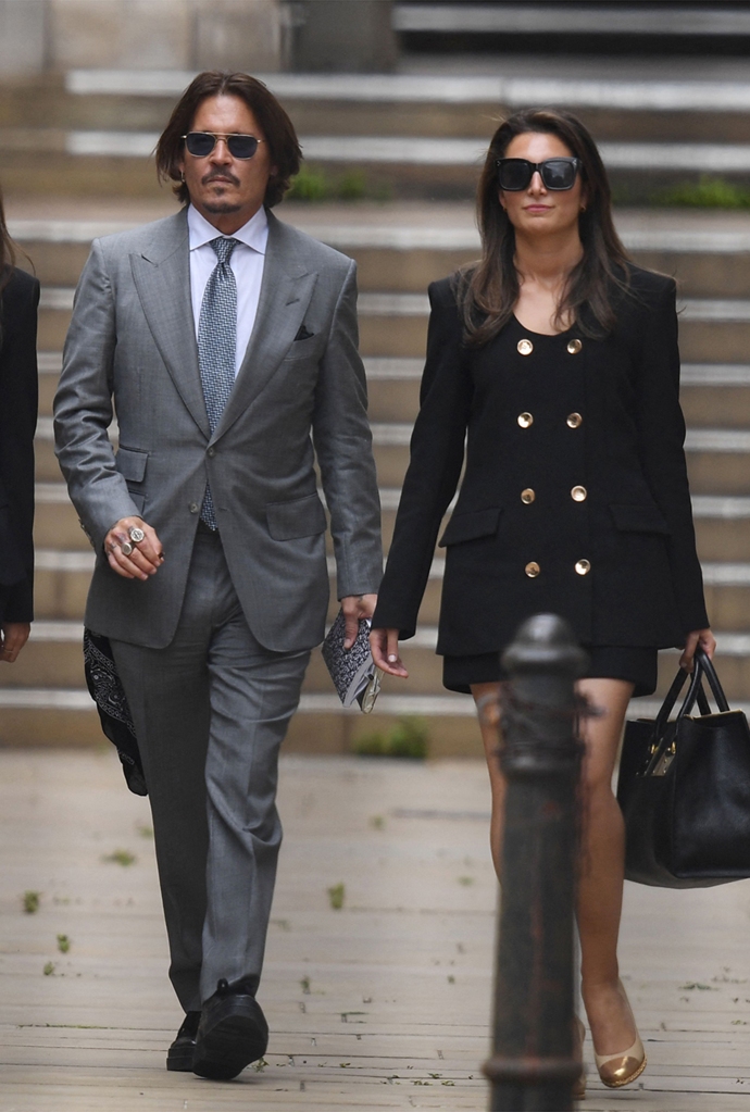 US actor Johnny Depp (2R) leaves with members of his team including lawyer Adam Waldman (L) after day eight of his libel trial against News Group Newspapers (NGN) at the High Court in London, on July 16, 2020.