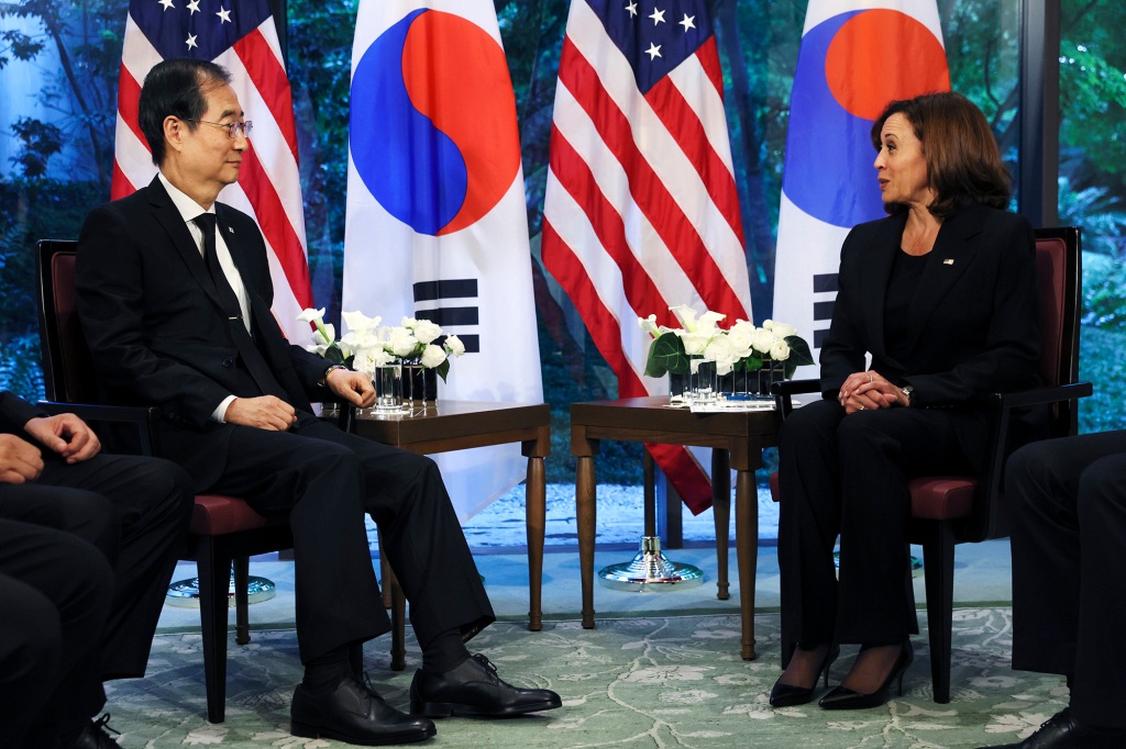 South Korea's Prime Minister Han Duck-soo, left, listens as U.S. Vice President Kamala Harris speaks.