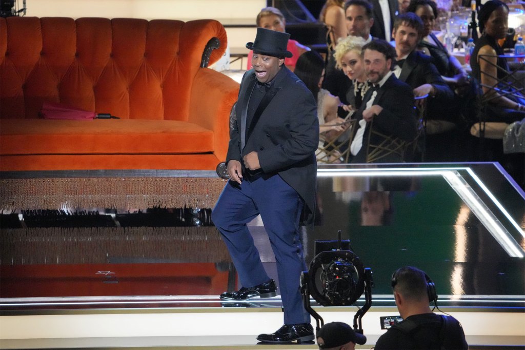Emmys host Kenan Thompson in the show's awkward opening segment. He's wearing a tux and tails and a tophat and is dancing on the stage.