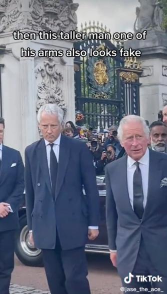 Bodyguards accompany King Charles III outside Buckingham Palace.