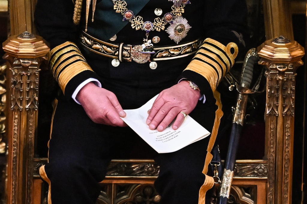 Prince Charles, Prince of Wales holds the Queen's Speech in his hands after reading it in the House of Lords Chamber, during the State Opening of Parliament in the House of Lords at the Palace of Westminster on May 10, 2022 in London, England.