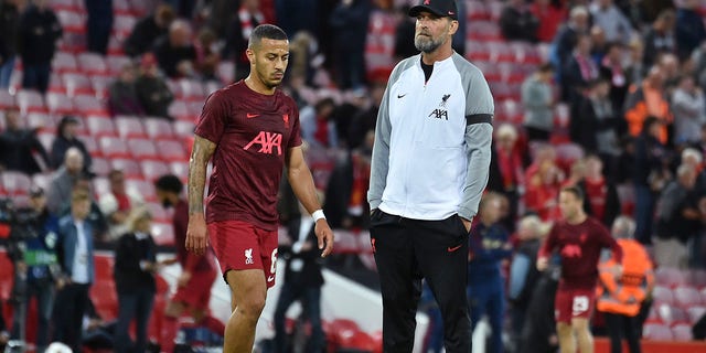 Liverpool's manager Jurgen Klopp, right, stands during the warm up prior to the start of the Champions League group A soccer match between Liverpool and Ajax at Anfield stadium in Liverpool, England, Tuesday, Sept. 13, 2022.