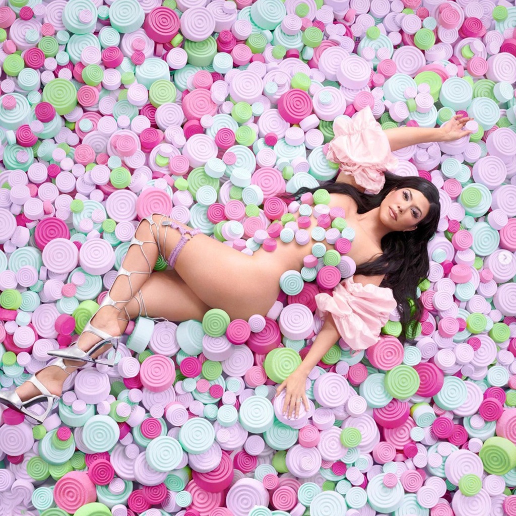 Kourtney Kardashian posed nude in a sea of vitamins to promote her new supplement line, Lemme.