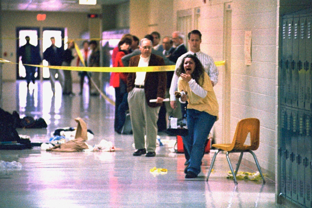 A Heath High School student screams at seeing the scene of a shooting at the school where fellow student Michael Carneal opened fire, leaving three students dead and five wounded Dec. 1, 1997.