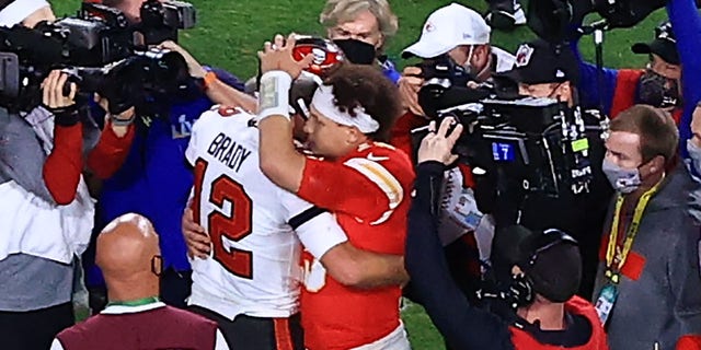 Tom Brady of the Buccaneers and Patrick Mahomes of the Kansas City Chiefs speak after Super Bowl LV at Raymond James Stadium on Feb. 7, 2021 in Tampa, Florida.