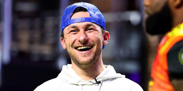 Johnny Manziel laughs on the field during Fan Controlled Football Season v2.0 - Week Seven on May 28, 2022 in Atlanta, Georgia. (Photo by Casey Sykes/Fan Controlled Football/Getty Images)