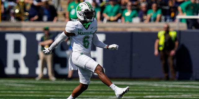 Marshall defensive back Micah Abraham celebrates a sacks against Notre Dame during the first half of an NCAA college football game in South Bend, Ind., Saturday, Sept. 10, 2022.