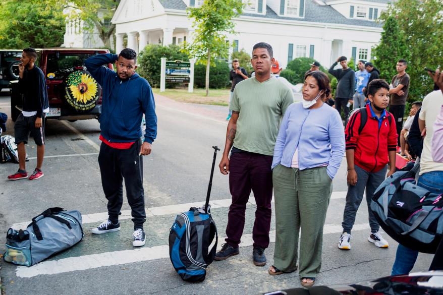 Migrants, who arrived on a flight sent by Florida Gov. Ron DeSantis, gathered with their belongings outside St. Andrews Episcopal Church in Martha's Vineyard.