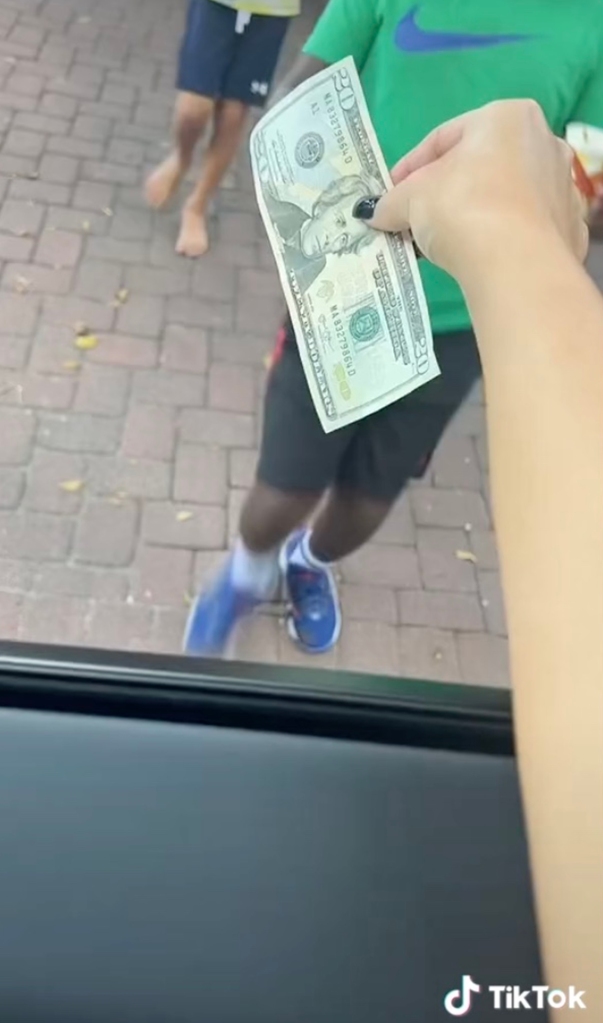 Person handing money to another