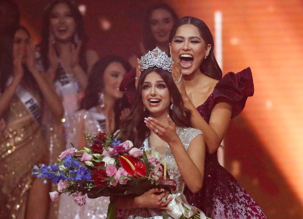 Miss Universe 2020 Andrea Meza, right, crowns India's Harnaaz Sandhu as Miss Universe 2021 during the 70th Miss Universe pageant, Monday, Dec. 13, 2021,