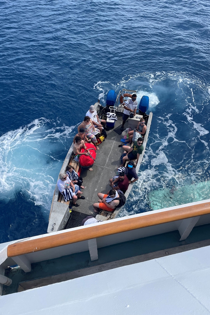 Justine and her sons resorted to swimming to a garbage collector after their divemaster urged swim toward a nearby island.