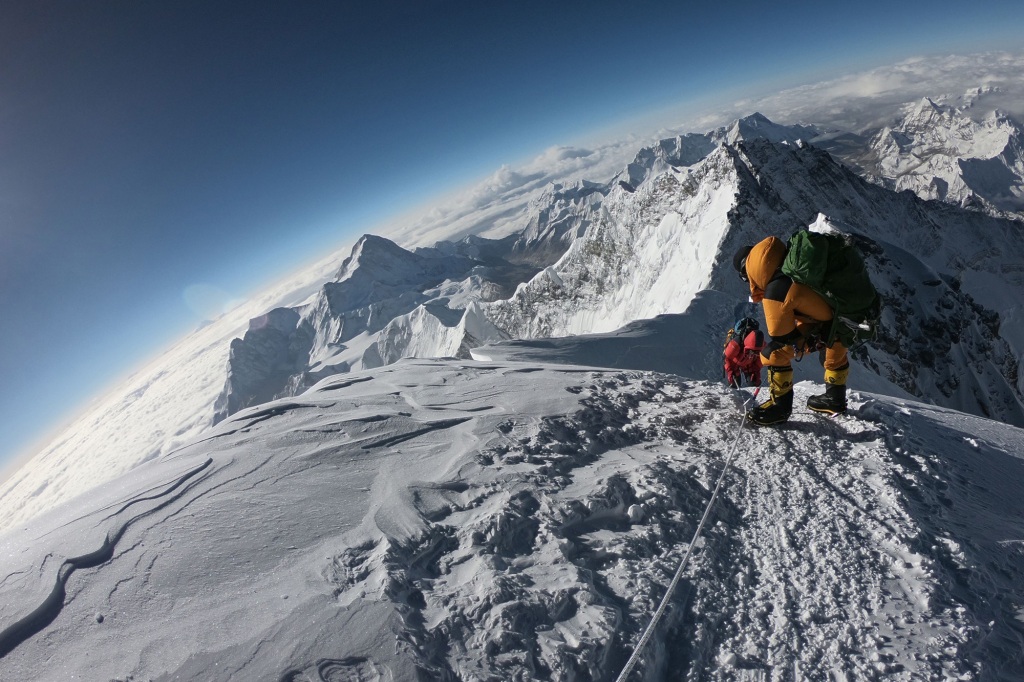 Mountaineers make their way to the summit of Mount Everest, as they ascend on the south face from Nepal.