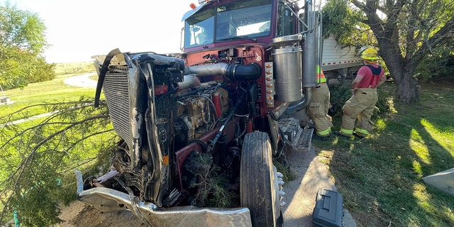 The 20-year-old driver of the truck was injured and taken to a hospital.