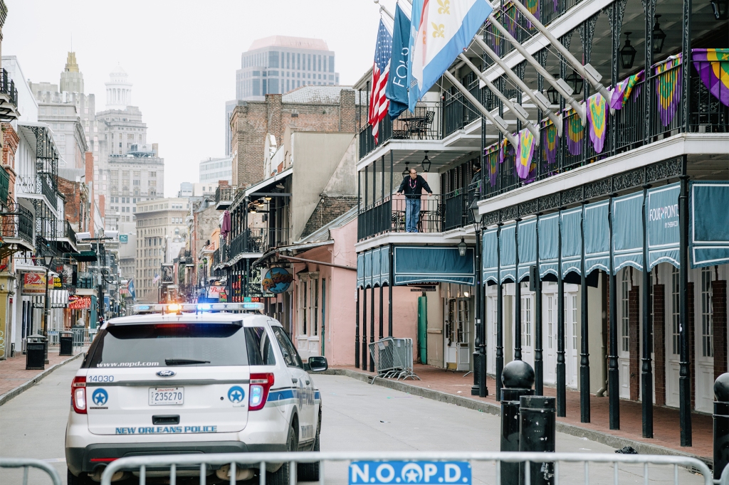 A police vehicle blocks access to Bourbon Street in New Orleans,