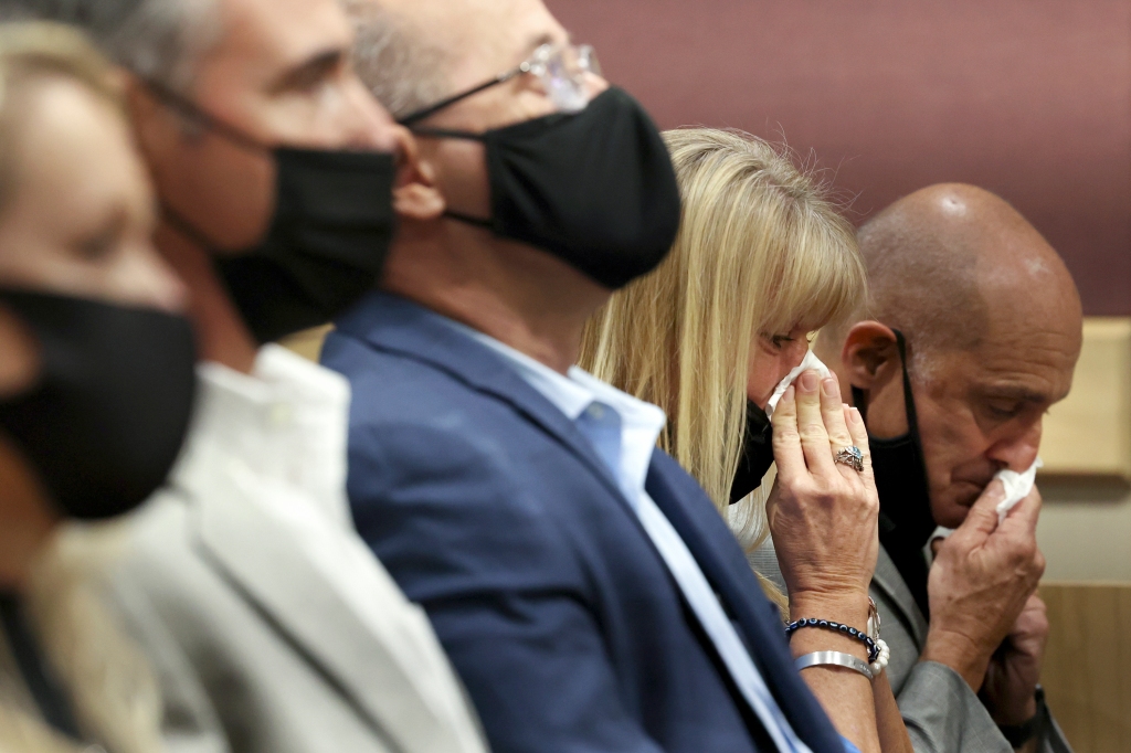 Annika Dworet and her husband, Mitch Dworet, wipe away tears as their son's name is read aloud during Marjory Stoneman Douglas High School shooter Nikolas Cruz's guilty plea on all 17 counts of premeditated murder and 17 counts of attempted murder in the 2018 shootings, at the Broward County Courthouse in Fort Lauderdale, Florida on Oct. 20, 2021.