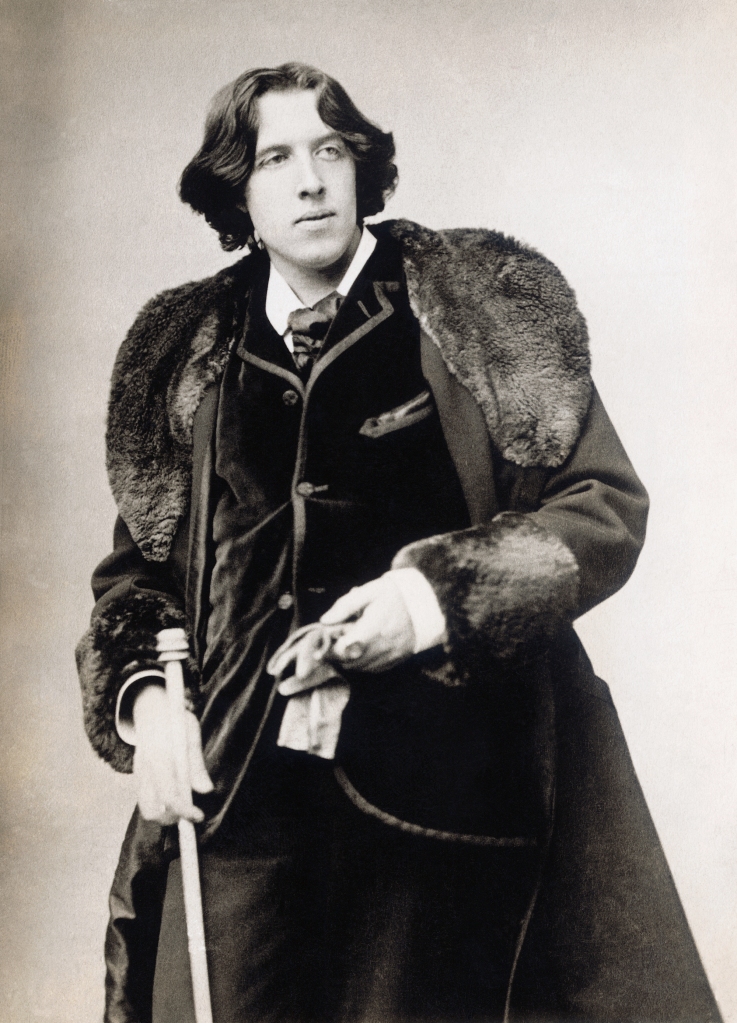 A black and white image of Oscar Wilde.