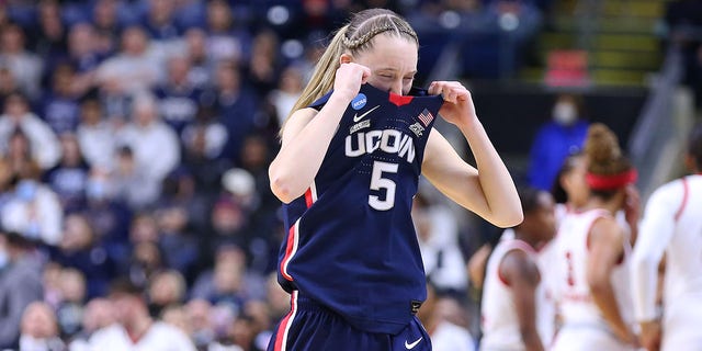 UConn Huskies guard Paige Bueckers reacts after witnessing an injury to teammate Dorka Juhasz during an Elite Eight NCAA tournament game against the N.C. State Wolfpack March 28, 2022, at Total Mortgage Arena in Bridgeport, Conn.