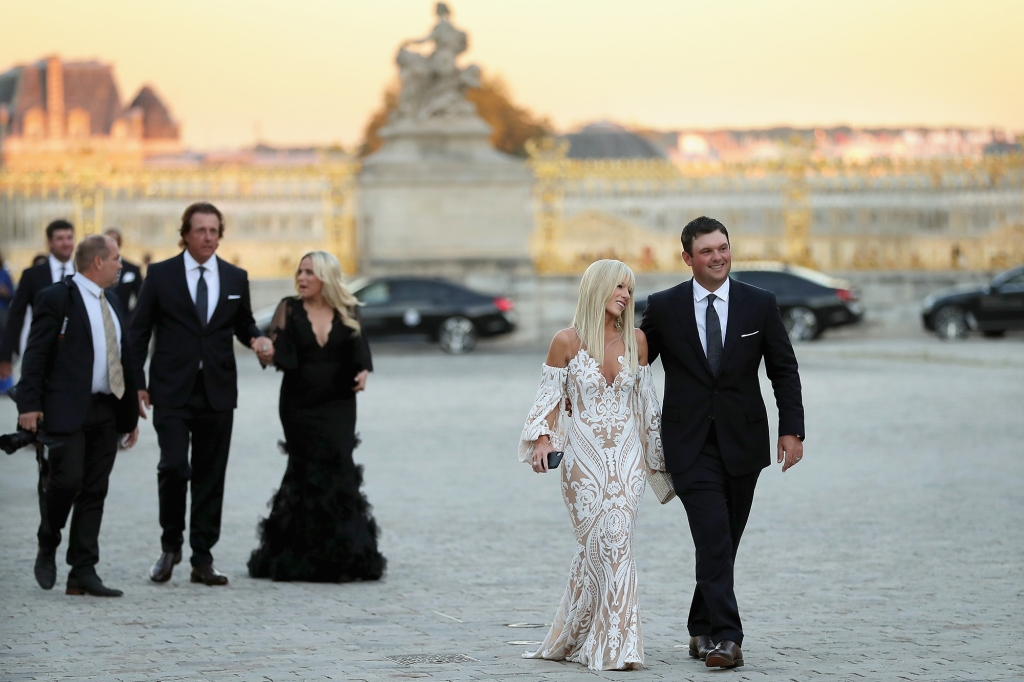 Reed and his wife Justine arrive for the Ryder Cup gala dinner at the Palace of Versailles ahead of the 2018 tournament. 