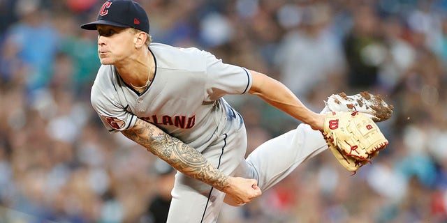 Zach Plesac of the Cleveland Guardians pitches during the first inning against the Seattle Mariners at T-Mobile Park Aug. 27, 2022, in Seattle.