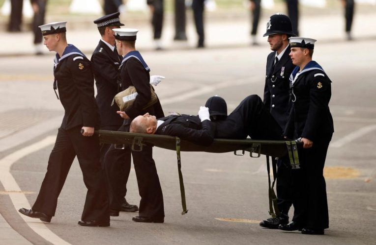 Policeman collapses, carried on stretcher at Queen’s funeral